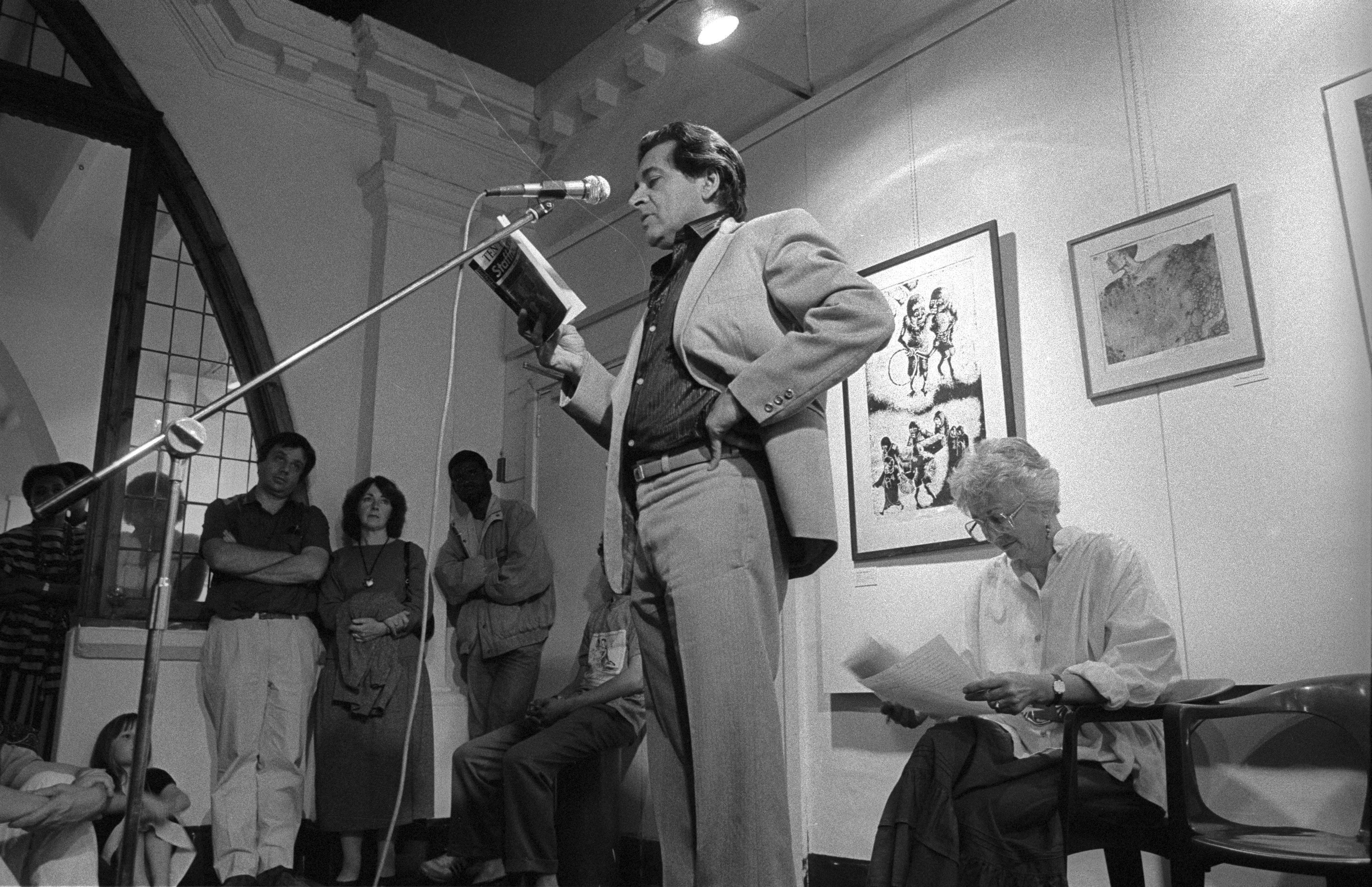 Writer Ahmed Essop speaking at Market Photo Gallery - 10 years of Staffrider exhibition and book launch 1988. © Omar Badsha
