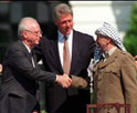 Yitzhak Rabin and Yasser Arafat, shake hands after concluding the Declaration of Principles for Peace between Palestinian Arabs and Israelis
