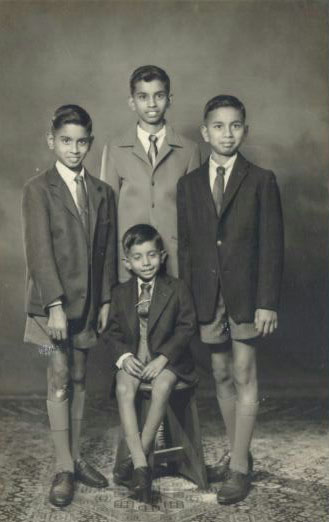 Dr Somalingum Leslie Ponnusamy - seated - with his brothers (L-R) Denny, Billy, Roy