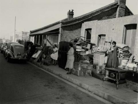 Sophiatown residents with their possessions in the street after being evicted, circa 1955.