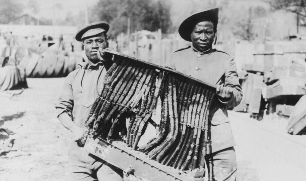 South African Native Labour Corps holding a shell-shattered radiator