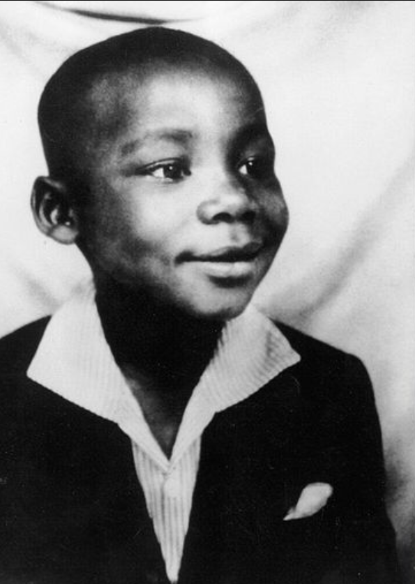  Mandela in Umtata, in his first suit, presented to him by the Paramount Chief of the abaThembu, Jongintaba Dalindyebo. Â© Mayibuye Centre.