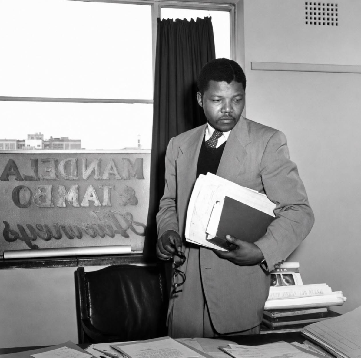 Nelson Mandela pictured in 1952 at the offices of his legal partnership with Oliver Tambo. Photographer: JÃ¼rgen Schadeberg. Jurgen Schadeberg / The Drum Archive / african.pictures
