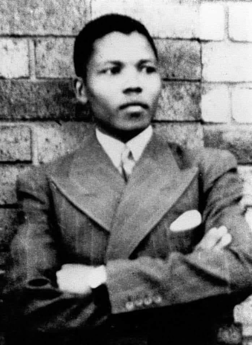 Mandela in Umtata, in his first suit, presented to him by the Paramount Chief of the abaThembu, Jongintaba Dalindyebo. Â© Mayibuye Centre.