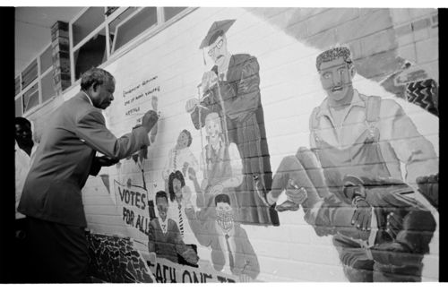 Mandela signing mural at Alexander Sinton High School, 1992