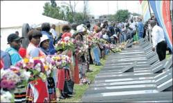 Families lay wreaths during the 25th anniversary of the Sebokeng Massacre where 39 people were killed while attending an all-night vigil 