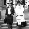 Winnie Mandela (left) descends the steps of the Palace of Justice during the Rivonia Trial.1964