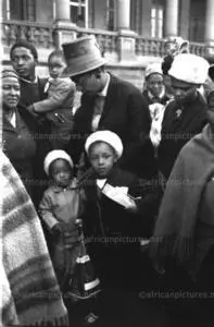 Winnie Mandela with daughters Zinzi and Zenani outside the palace of justice during the Rivonia trial.(BAHA)