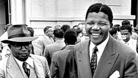 Moses Kotane and Nelson Mandela leave the Pretoria Court - 13 October 1958 - Pretoria