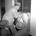 Police force open a window to the Indian Congress offices in Johannesburg on 31 July 1952