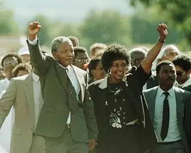 Nelson and Winnie Mandela greet the crowds and cameras moments after his release, 11 February 1990