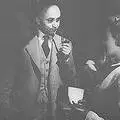 Dr. Dadoo during the Defiance Campaign trial, smoking his symbolic pipe whilst talking to Ruth First.