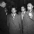 Walter Sisulu and Yusuf Dadoo (on right with pipe) during Treason Trial 1956.