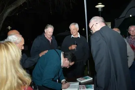 Glenn Moss signing books at the Johannesburg launch. Looking on (l-r)Denis Kuny, Charles Nupen, Karel Tip