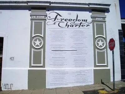 Freedom Charter painted on a wall in Woodstock, Cape Town by Shanghai Sigrid