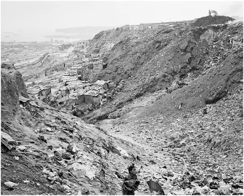 Woman on the footpath from Boa Vista to Roque Santeiro market, 2007 by Jo Ractliffe