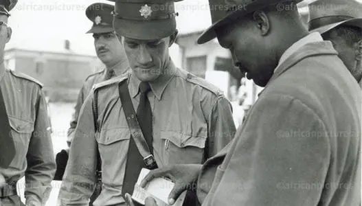 Police checking passes on the streets, 1960