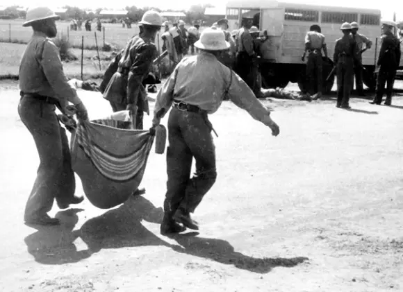 Police carrying a body - Sharpeville