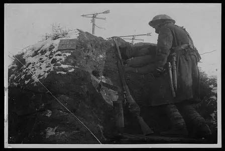 South African Soldier standing watch behind a large rock