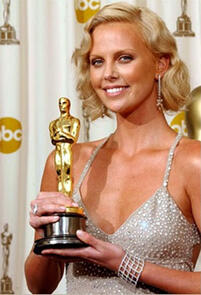 South African born Charlize Theron wins an Oscar for best actress in the movie Monster