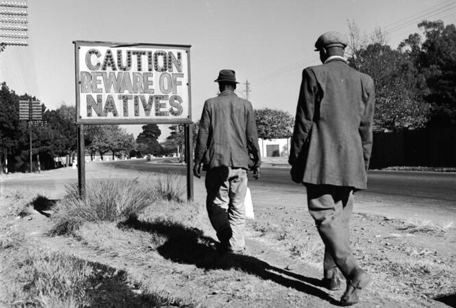 Warning sign at the entry of an area for "natives" Ejor/Getty Images 