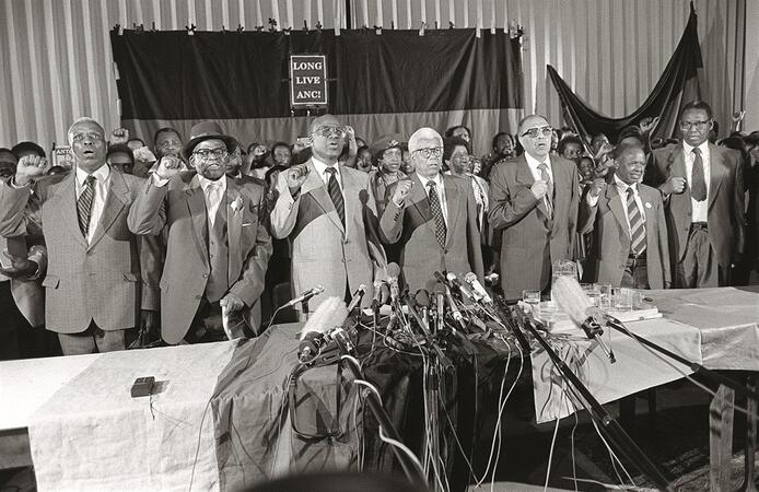 Walter Sisulu, Raymond Mhlaba and Ahmed Kathrada address the public after 26 years