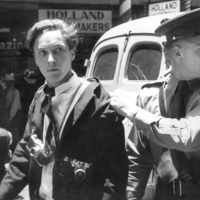 Jürgen Schadeberg being arrested in Johannesburg for protecting one of his colleagues at Drum magazine, 1958. Photograph © Ian Berry.png