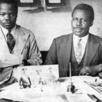 A. W. G. Champion at desk