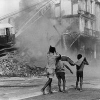 Boys watching destruction of District Six, South Africa, 1974