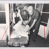 Injured victim wheeled into hospital. Silverton Siege, 1980. 