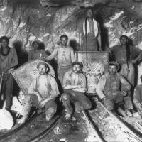 Black, Chinese and White laborers in a gold mine in South Africa